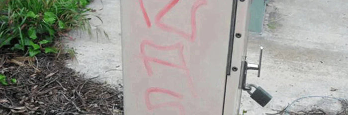 removing graffiti from painted or coated surface