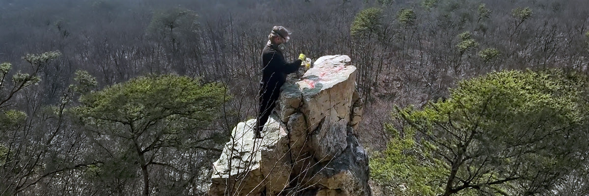 Paul removes graffiti from Natural Cliffside