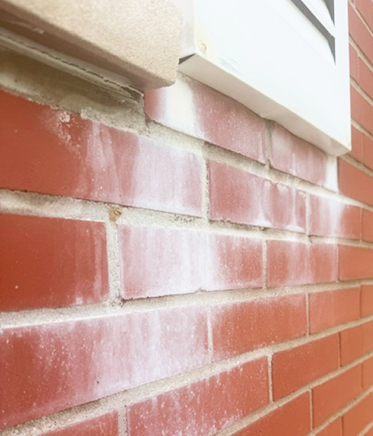 How to Remove Titanium Dioxide Paint Stains From Brick & Masonry